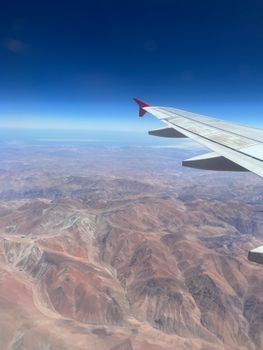 Stunning aerial view of the Atacama Desert, Chile, as seen from an airplane window.