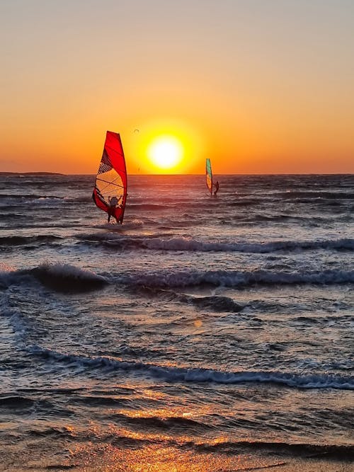 A Windsurfing on Sea during Sunset