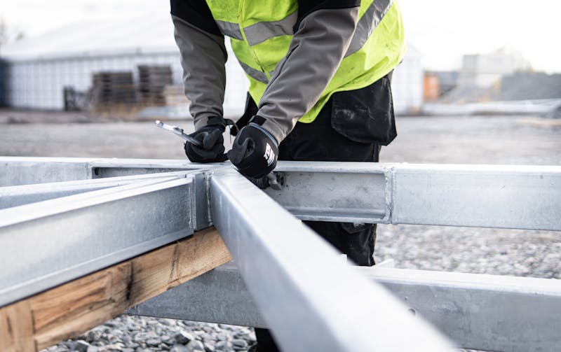 Ironworkers adjusting steel beams at a Local 8 construction project