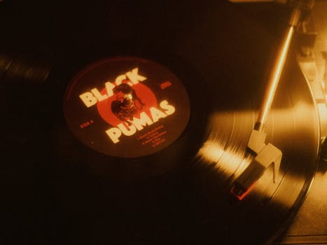 Vintage vinyl record playing on a turntable with a nostalgic ambiance.