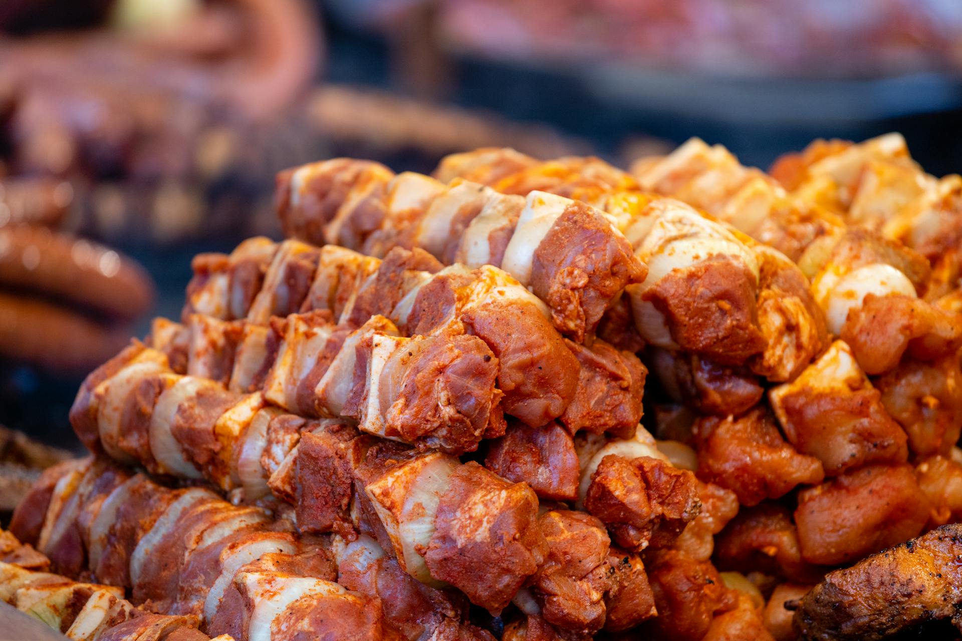 Close-up Photo of Marinated Raw Pork Skewers