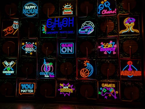 Variety of Neon Signs on the Wall
