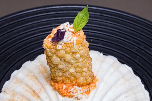 Pork crackling on a seashell