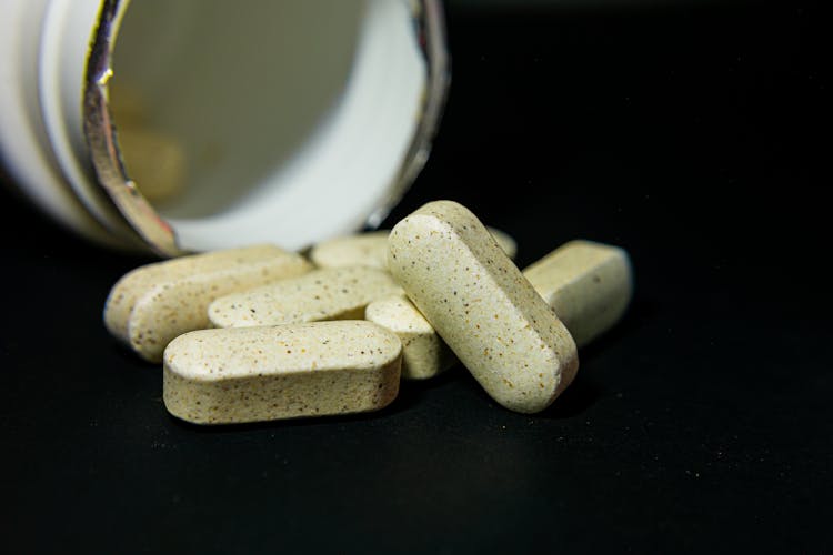 Medicine Capsules On The Black Background