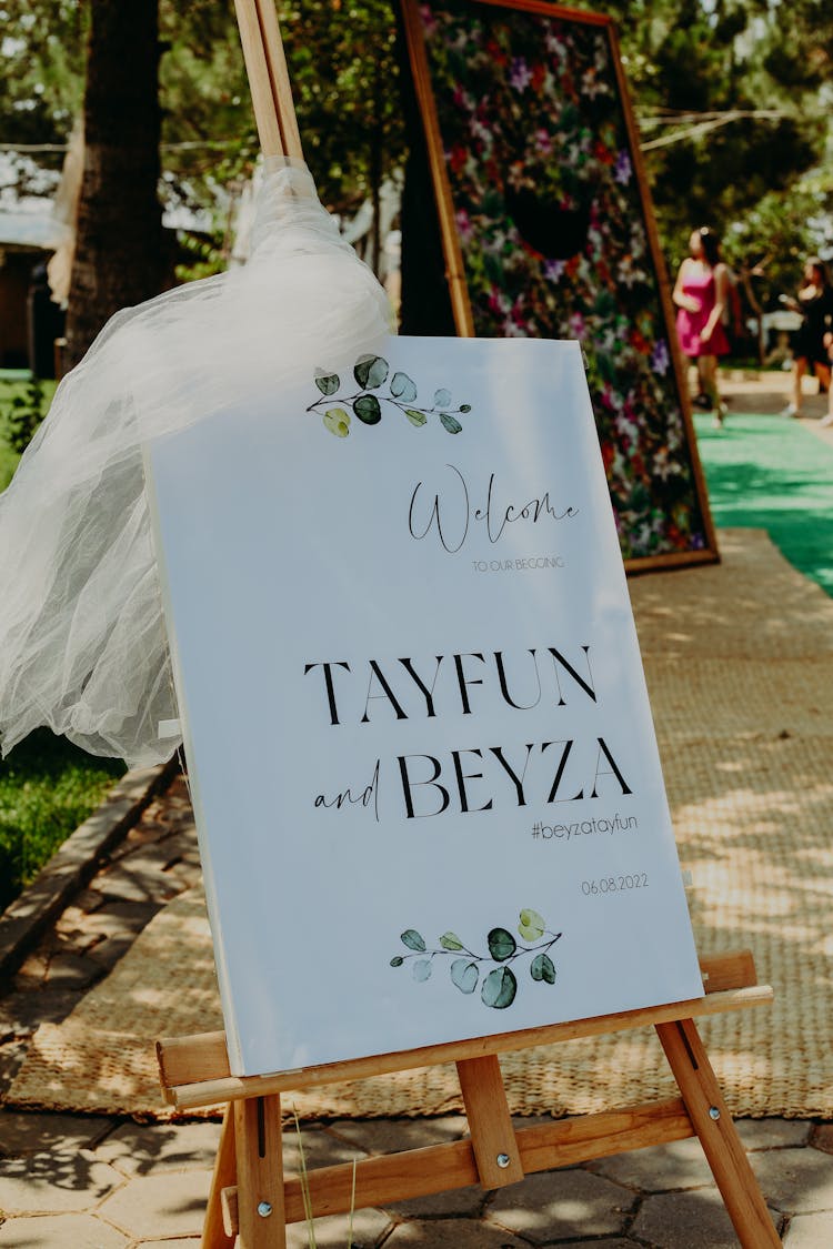 A Welcome Wedding Sign On A Wooden Easel Stand