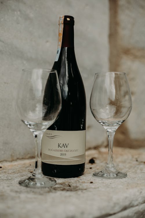 A Close-Up Shot of a Bottle of Wine and Wine Glasses