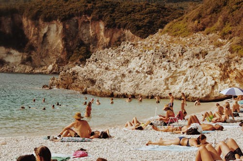 People Sunbathing on the Beach