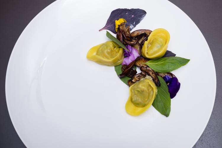 Dumplings And Vegetables In The White Plate