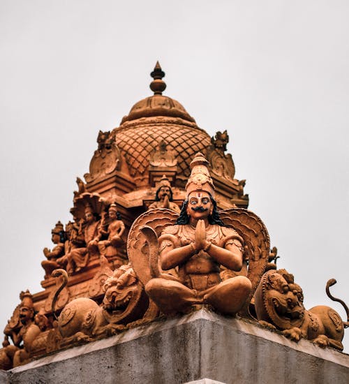 Low Angle Shot of Carved Statues on a Roof of a Hindu Temple 
