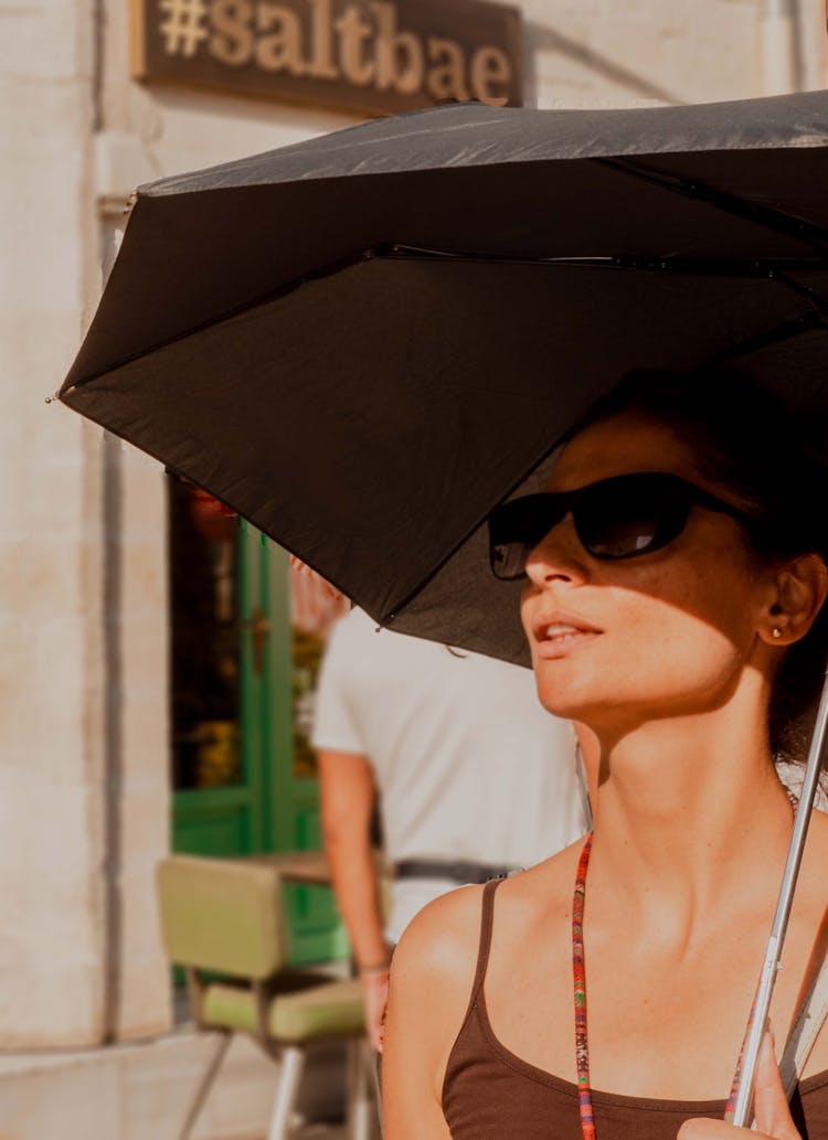 A Woman Under An Umbrella 