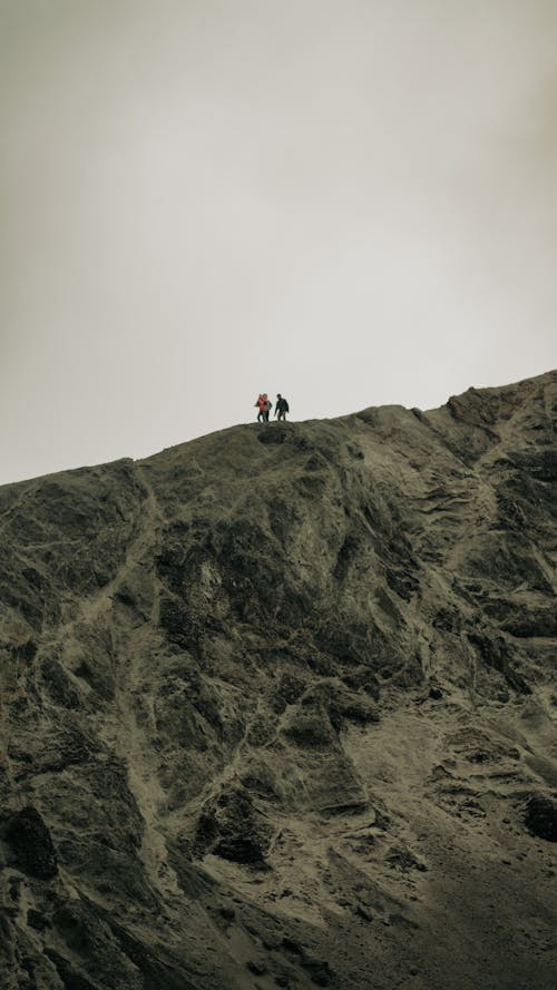 People Hiking on a Cloudy Day