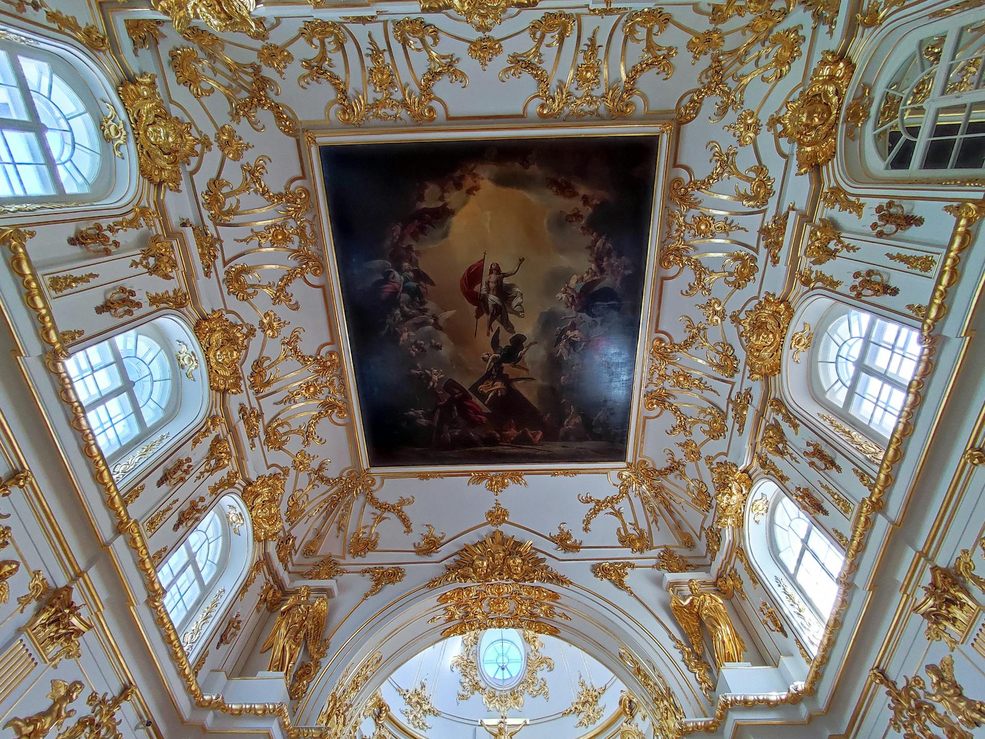 Elegant detailed ceiling with gold embellishments in Saint Petersburg.