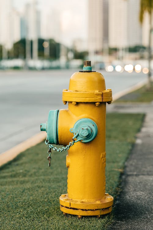 Yellow Water Hydrant on the Sidewalk