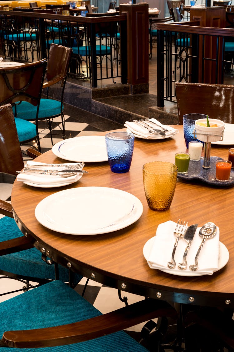 Plates And Cutlery On Tablet In Restaurant