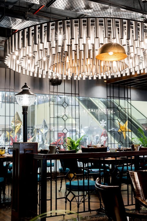 Chandelier above Empty Chairs in Restaurant