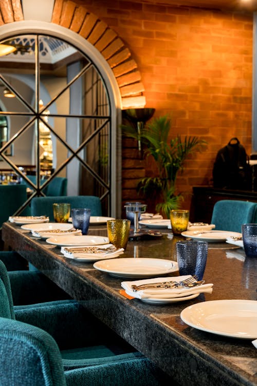 Photo of Cutlery on a Table in a Restaurant