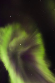 Stunning display of aurora borealis lighting up the night sky over Yellowknife, Canada.
