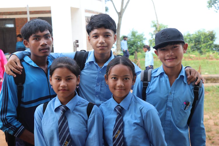 Students In Uniforms Posing For Photo