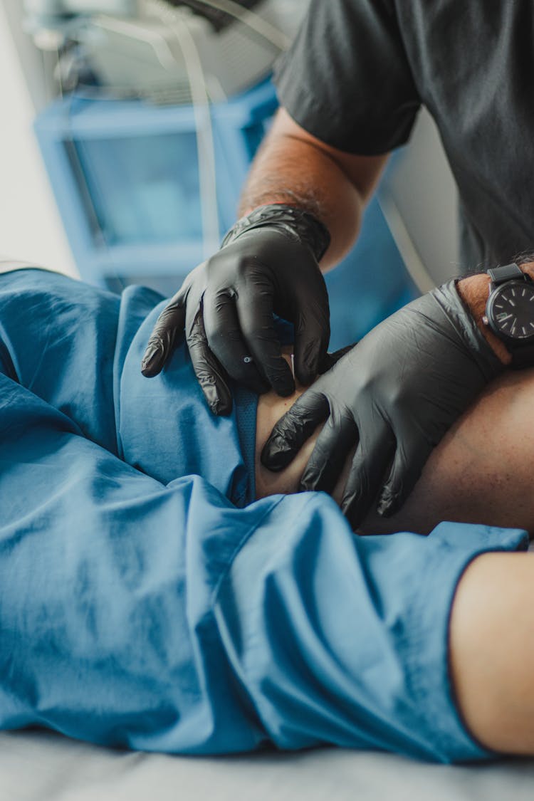 An Acupuncturist Treating A Patient