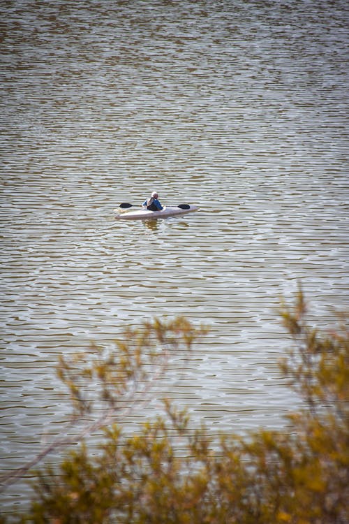 A Person Kayaking on a River