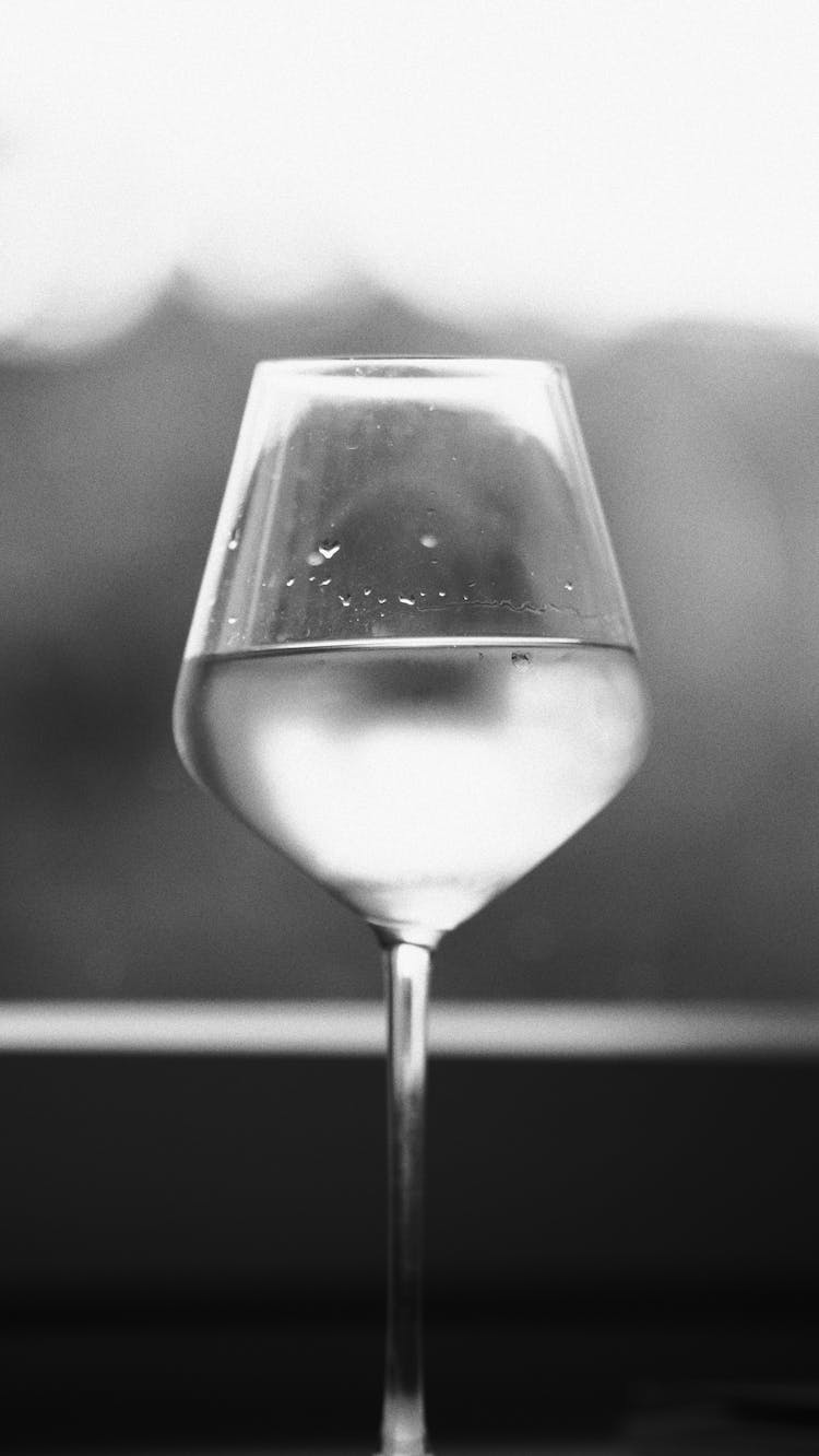 Grayscale Photo Of A Water Goblet