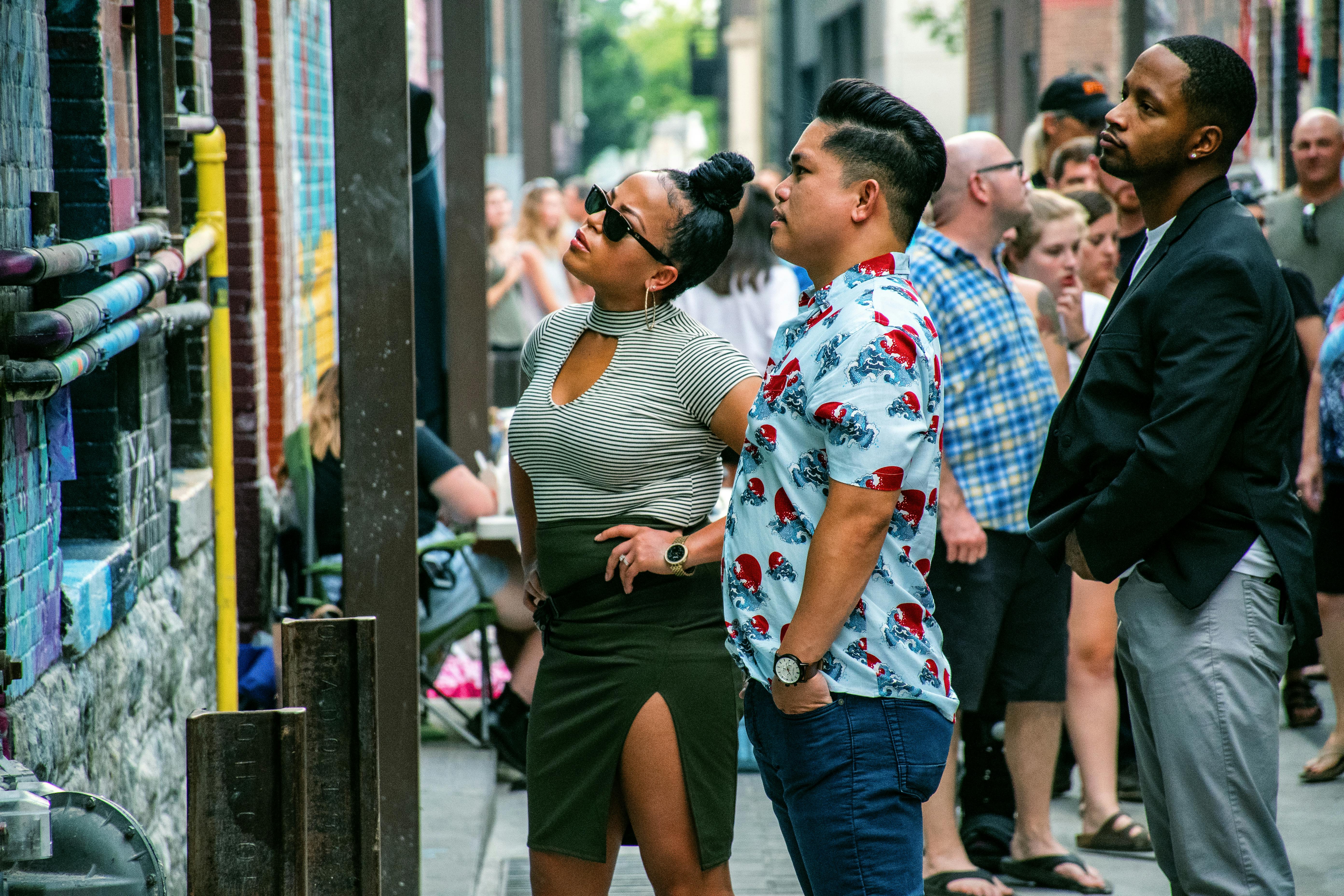 Busy food truck with customers lined up on urban street