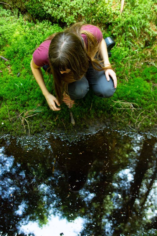 Overhead Shot of a Woman Looking at the Water