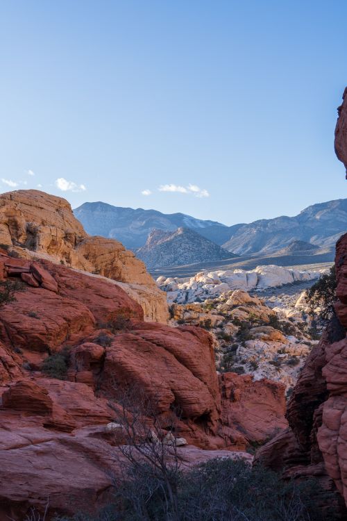 Free Breathtaking view of the rugged red rock formations at Red Rock Canyon with a clear blue sky. Stock Photo