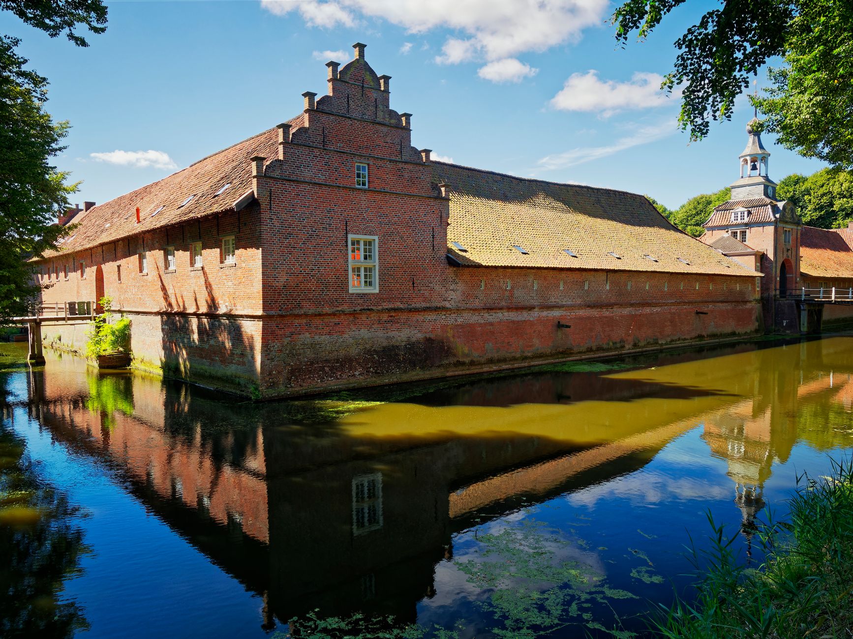 Medieval Kuressaare Episcopal Castle reflected in its moat on Saaremaa