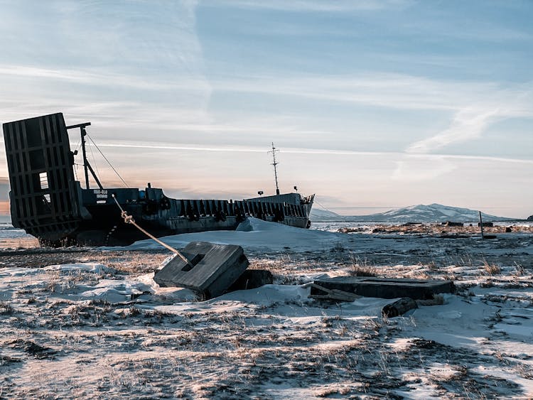 A Shipwreck On A Snow-Covered Field