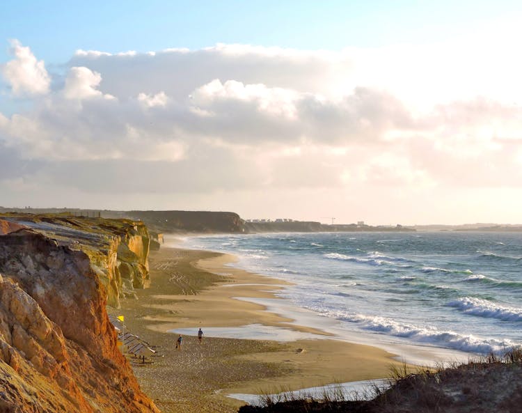 People Walking On The Beach