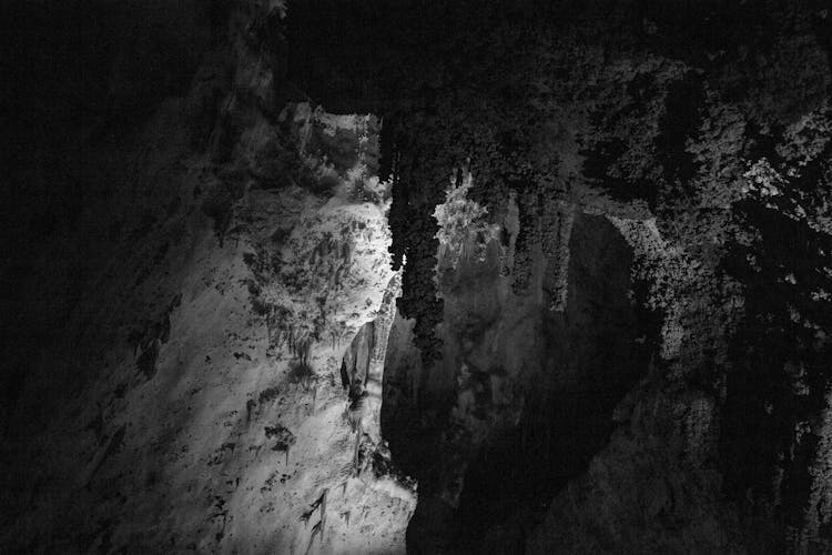 Grayscale Photo Of A Cave