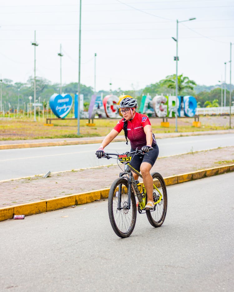 Woman Riding A Bicycle