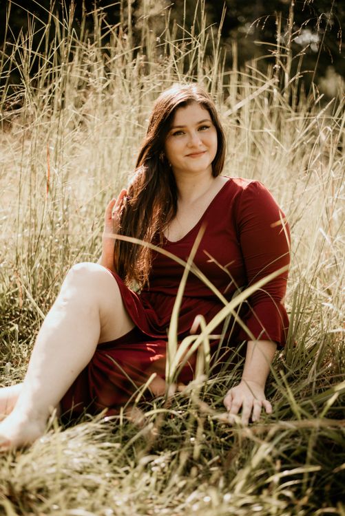 A Woman Sitting on Grass · Free Stock Photo