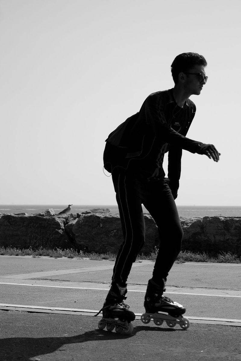 Silhouette of a skater near the coastline