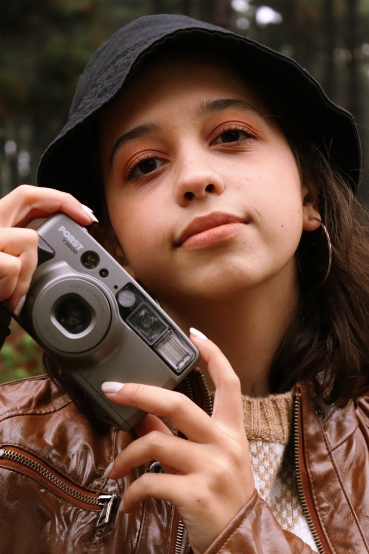 Woman In Black Bucket Hat Holding A Camera