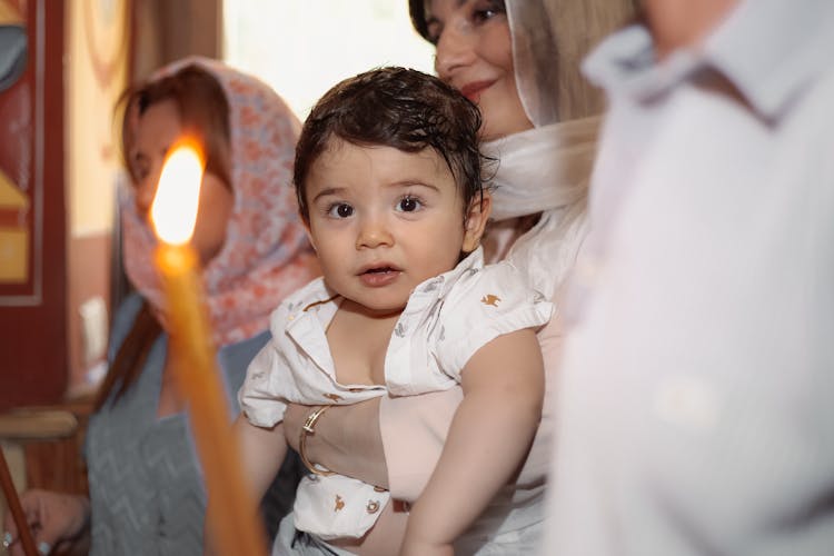 Family With Baby During Religious Celebration