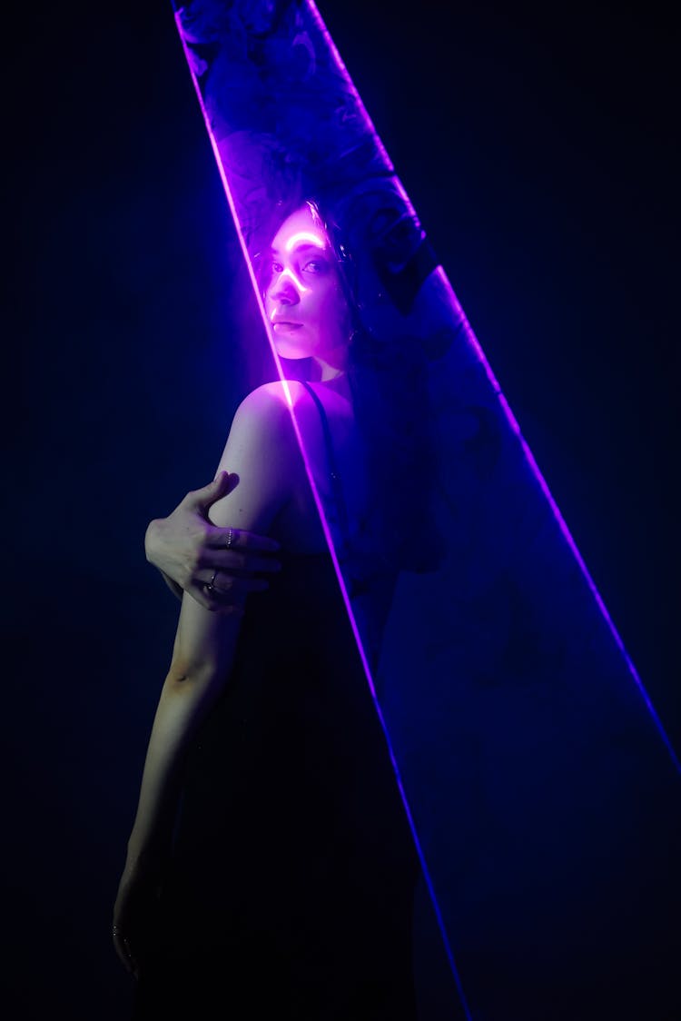 Woman Posing In Purple Light