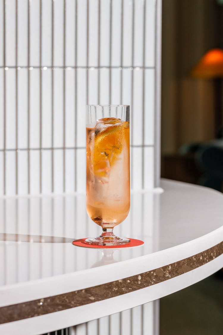 Cocktail In Glass On Table In Bar