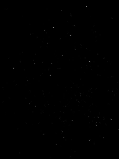 Free A stunning night sky full of brilliant stars twinkling against a dark backdrop. Stock Photo