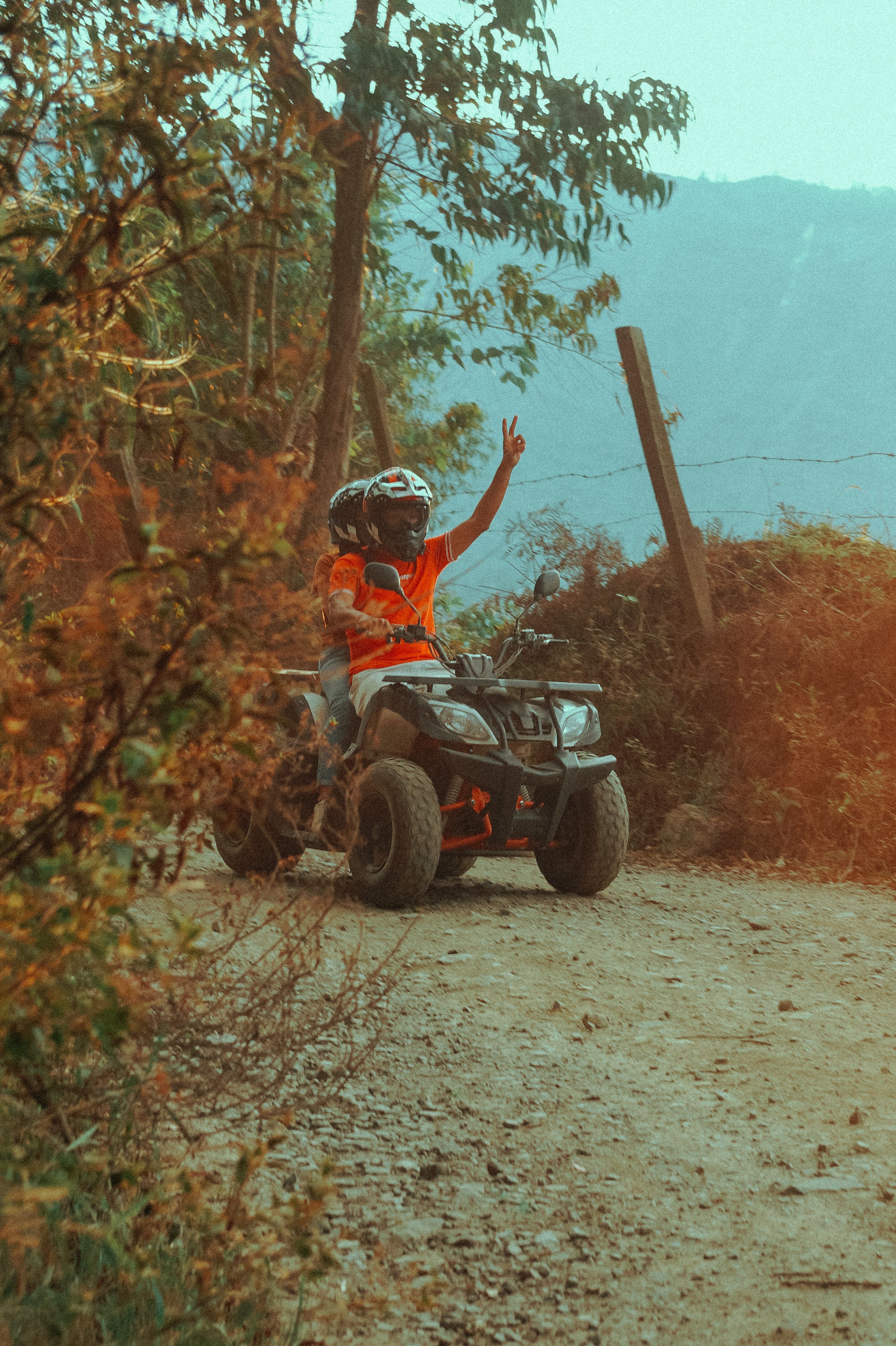 People Riding Quad Bike on Hill · Free Stock Photo