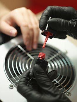 Close-up of a manicure in progress with red nail polish. Professional care in Kharkiv, Ukraine.
