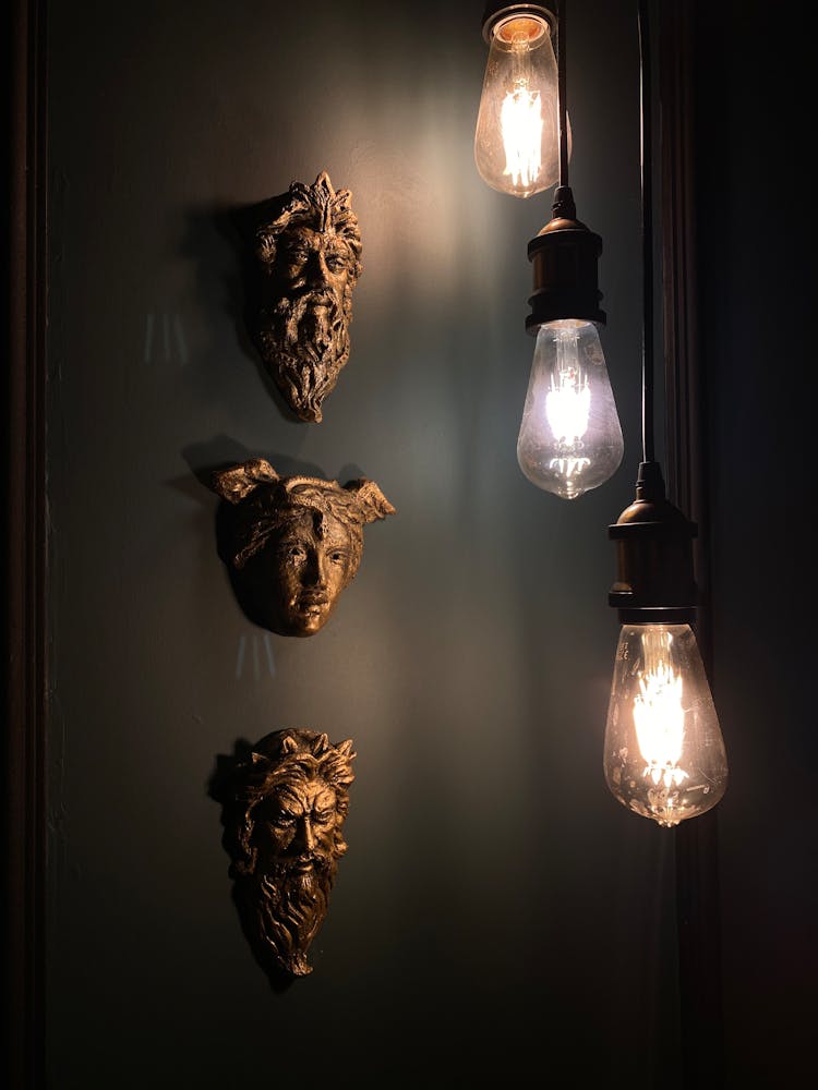 Lamps Hanging Near Classic Sculptures Heads