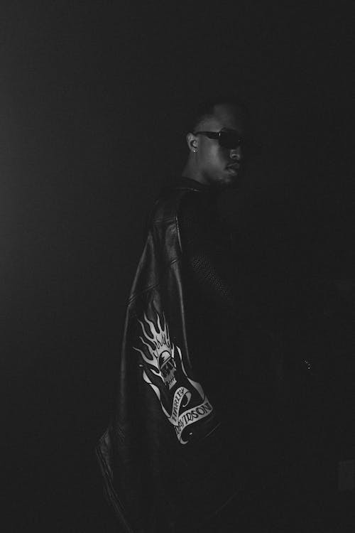 African Man Wearing Leather Jacket in Black and White 