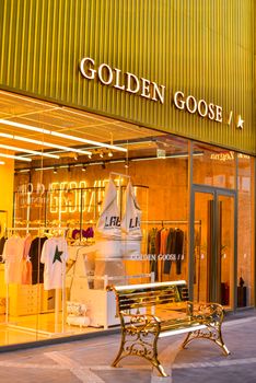 Modern Golden Goose retail store with stylish gold decor in Istanbul.