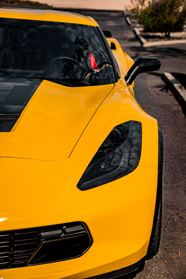 Yellow Chevrolet Corvette On Street