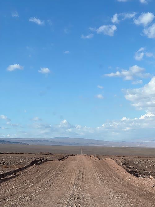Photo of a Dirt Road against the Sky 