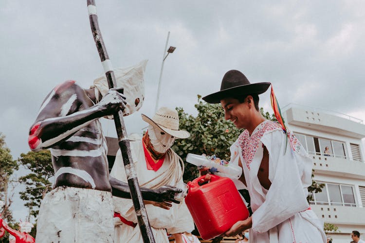 A Man Pouring Booze In Plastic Cup