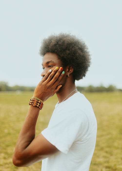 Man with Colorful Manicure on Hand