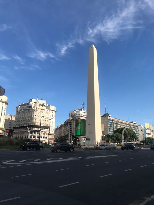Free The Obelisk of Buenos Aires with bustling street and clear sky in downtown. Stock Photo